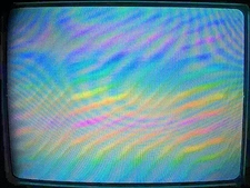 Hands holding a CRT monitor